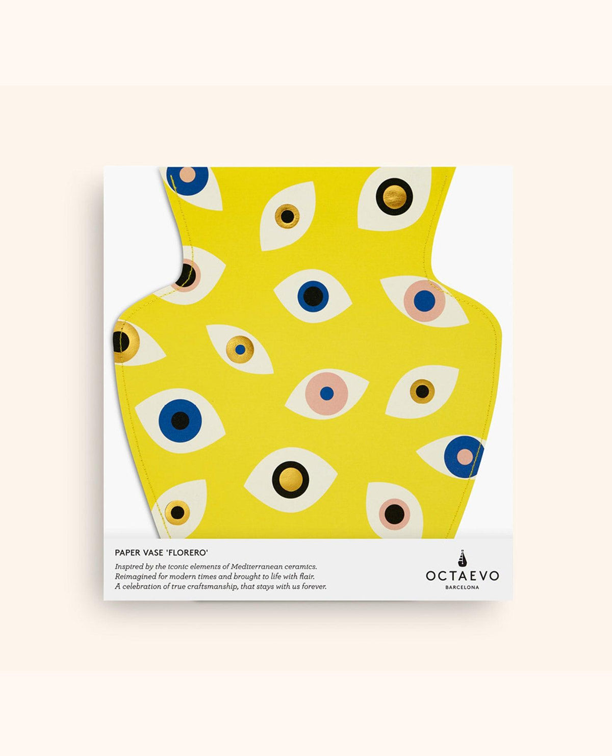 The Nazar Paper Vase by OCTAEVO in yellow with abstract eyes and gold detail, presented in white packaging.