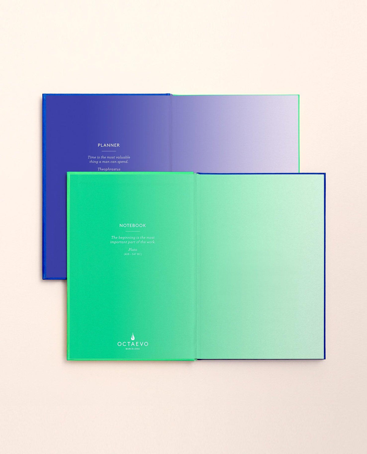 Two open OCTAEVO Notebook Planners, one mint and one blue, show title pages on a beige surface.
