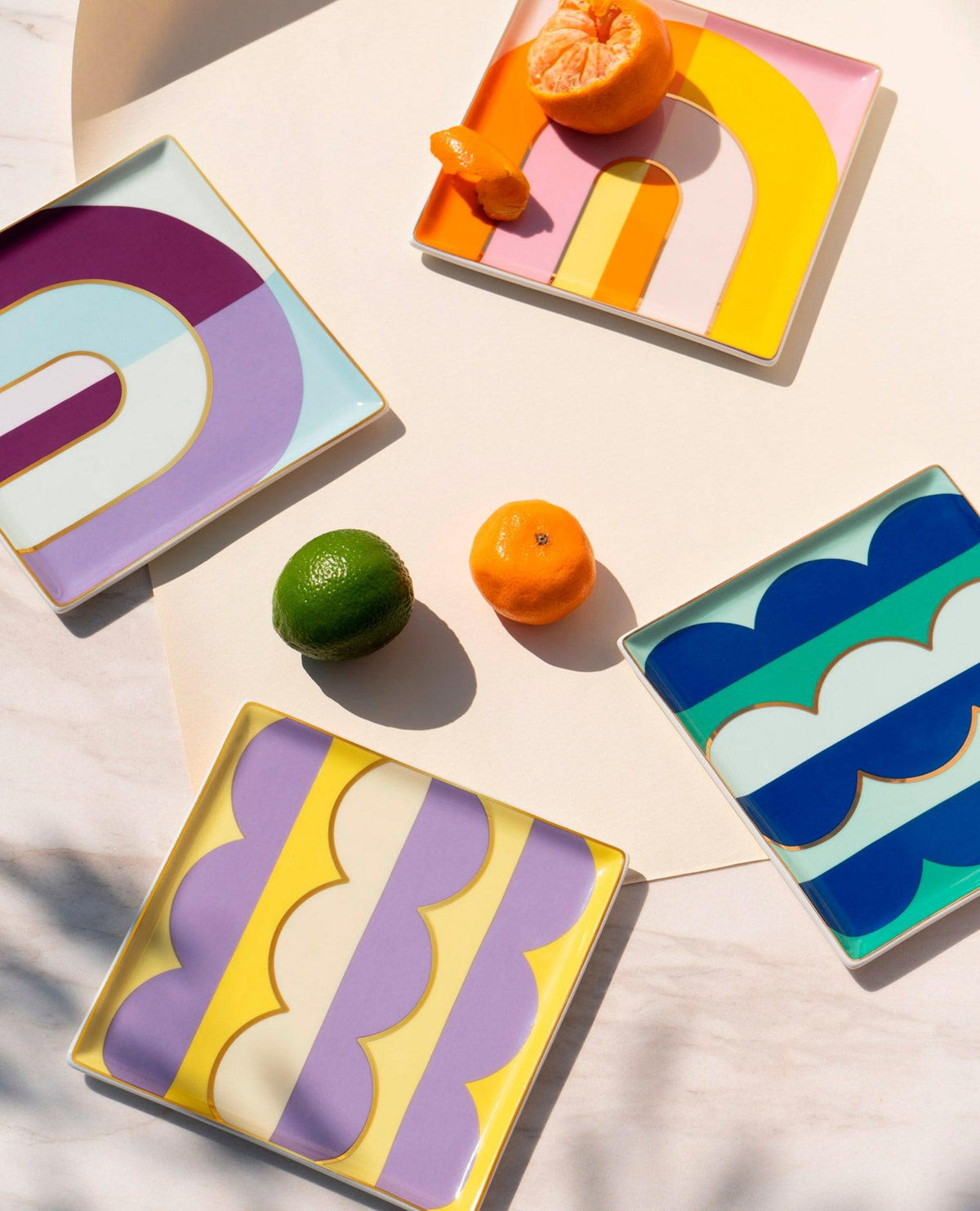 Group of OCTAEVO Riviera Ceramic Trays brightens your table with their colorful, citrus-inspired design.