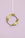 The purple OCTAEVO Sicilia Ceramic Trivet is displayed on a wall, adding a decorative pastel touch.