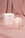 A Templo Candle by OCTAEVO and its box rest on pink satin, both elegantly labeled with the brand name.